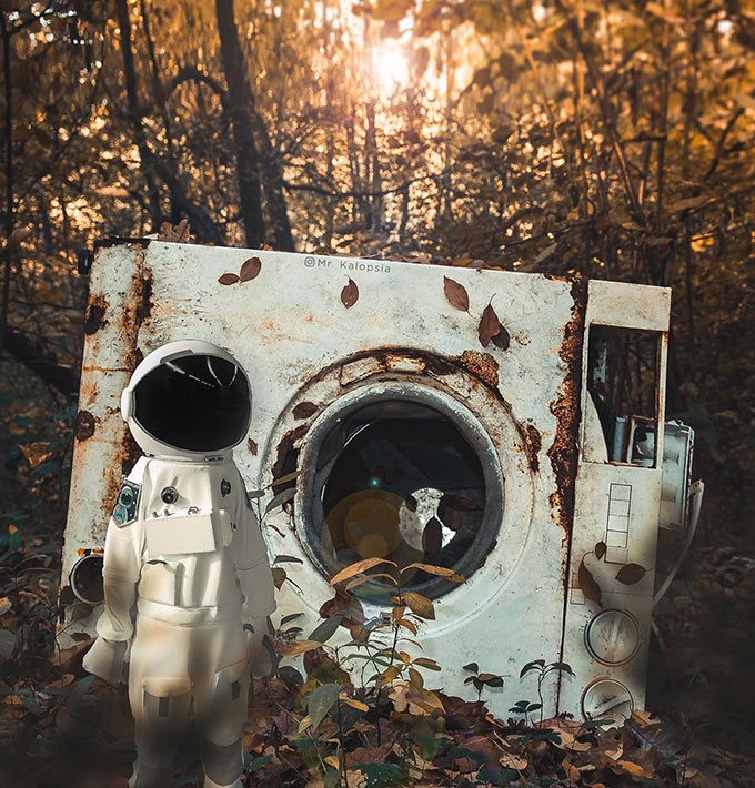 astronaut beside old washing machine
