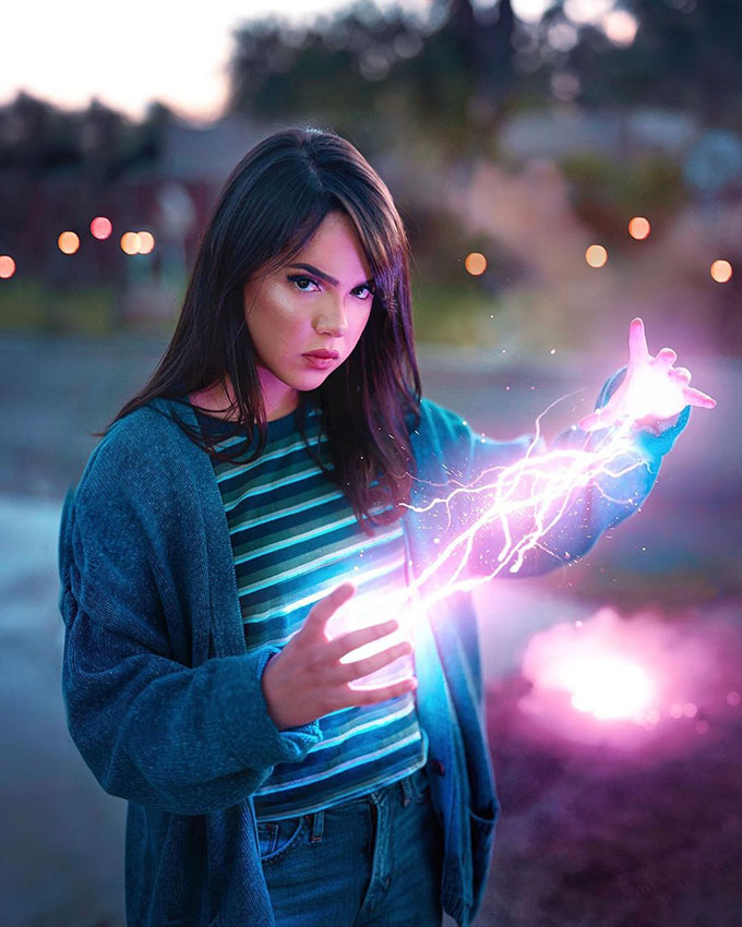 Girl with thunder effect in her hands