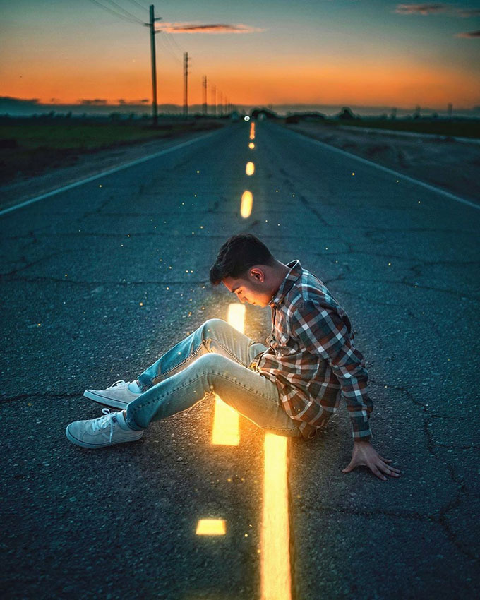 Glowing dashed lines on road with boy staring