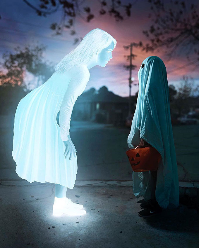 White ghost staring at fake little ghost photo composite